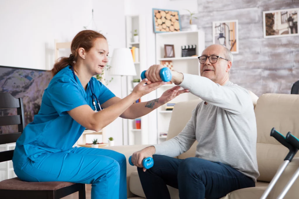 senior man in nursing home with doing physical