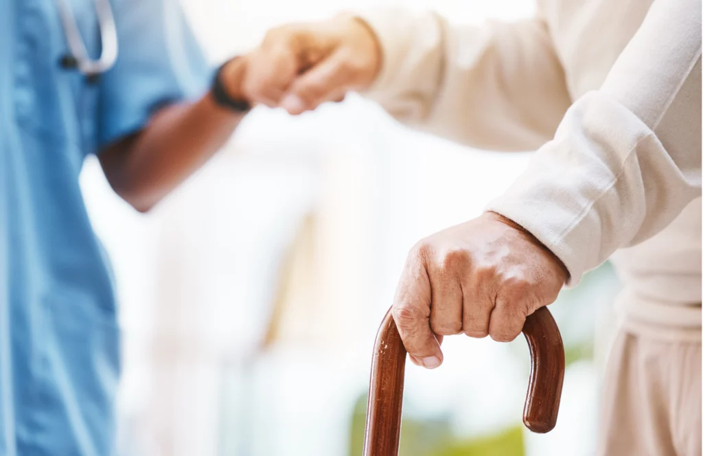 Walking stick nurse and hands helping patient with parkinson